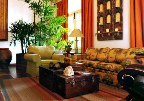 a living room with a couch and a table at Hotel Villa Bahia in Salvador