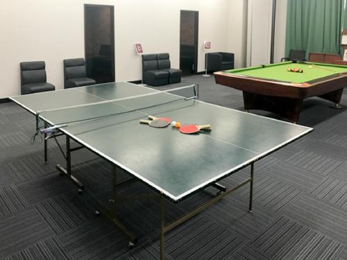 a room with two ping pong tables and a pool table at LiVEMAX RESORT Kinugawa in Nikko
