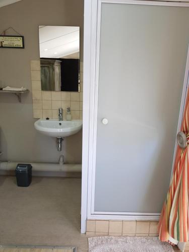 a bathroom with a sink and a mirror at Bethel B&B / Selfcatering in George