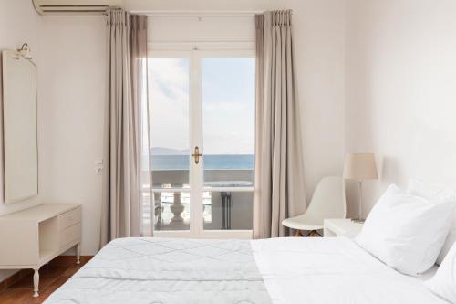 Ένα ή περισσότερα κρεβάτια σε δωμάτιο στο Hotel Roumani