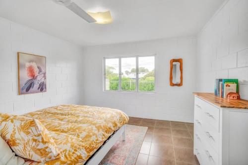 a bedroom with a bed and a window at 13 Indigo Avenue - 'Indigo Sands' - Rainbow Beach in Rainbow Beach
