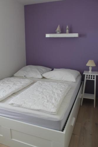 Postel nebo postele na pokoji v ubytování Strandhaus Glowe