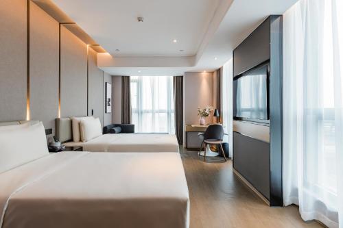 Katil atau katil-katil dalam bilik di Atour Hotel Suzhou North High-Speed Railway Station