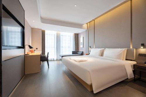 Postel nebo postele na pokoji v ubytování Atour Hotel Xian Software Park High-Tech 3rd Road