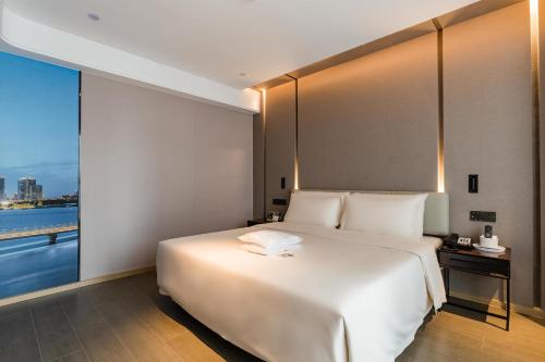 Katil atau katil-katil dalam bilik di Atour Hotel Suzhou North High-Speed Railway Station