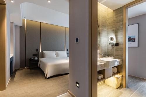 Katil atau katil-katil dalam bilik di Atour Hotel Yancheng ETDZ