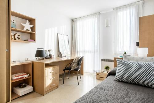 Postel nebo postele na pokoji v ubytování Residencia Universitaria Resa Francesc Giralt i Serrà