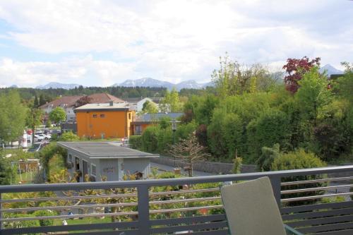 a balcony with a view of a city at Appartement Eveline in Velden am Wörthersee