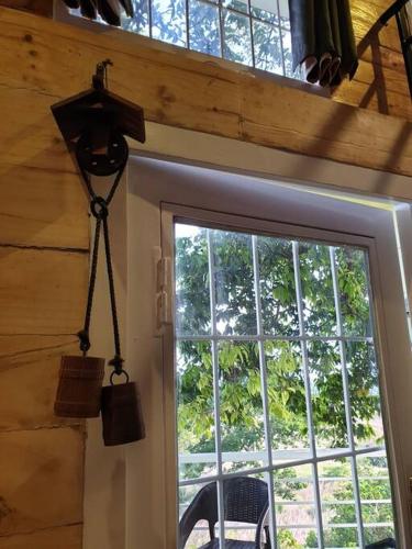 a room with a window and a door with a view at CAMP TREEHOUSE • COTTAGE • POOL • JACUZZI in Antipolo