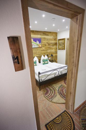 a bedroom with a bed in a room at Complex Butoaiele Transilvaniei - Cazare & SPA - Natura - Relaxare in Mediaş