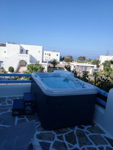 a bath tub sitting on top of a balcony at Annio studios in Plaka