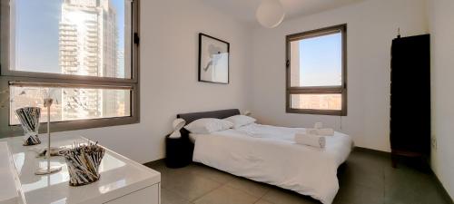 Ένα ή περισσότερα κρεβάτια σε δωμάτιο στο BnBIsrael apartments - Rouge Eilat