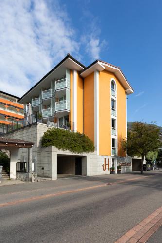 a building on the side of a street at Jazz Hotel Ascona in Ascona