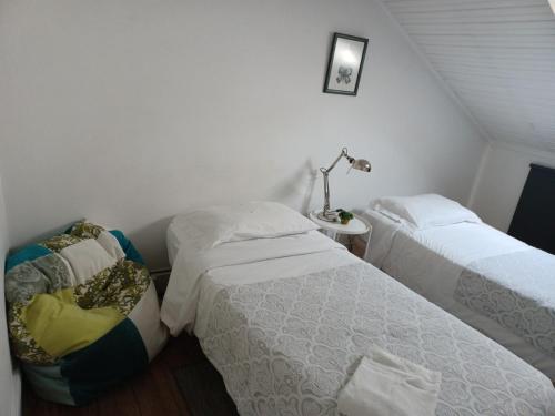 Postel nebo postele na pokoji v ubytování WW Hostel & Suites