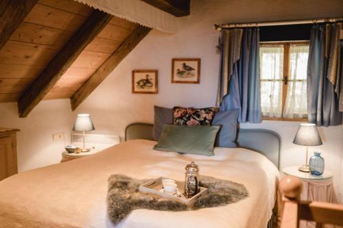Postel nebo postele na pokoji v ubytování Almchalet bei Pörtschach