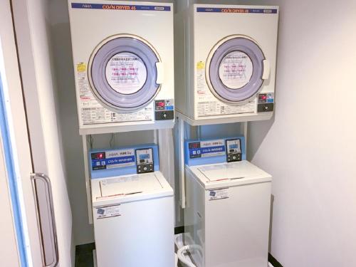 a row of automated machines in a room at HOTEL LiVEMAX Sendai Kokubuncho in Sendai