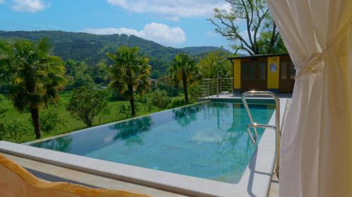 a swimming pool with a view of the mountains at Casa Valla by Rent Istria in Buzet