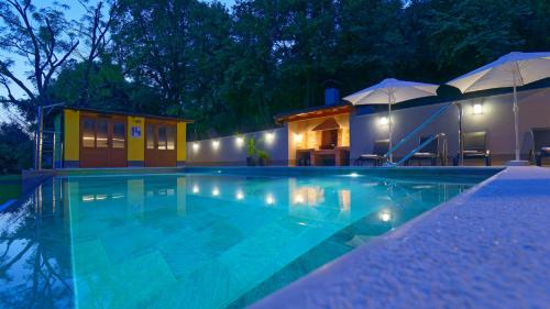 a villa with a swimming pool at night at Casa Valla by Rent Istria in Buzet