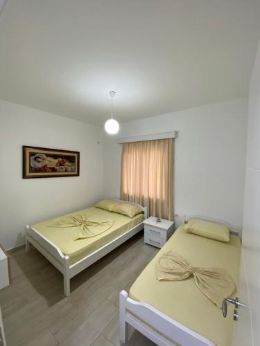 Ένα ή περισσότερα κρεβάτια σε δωμάτιο στο Hotel Andrea