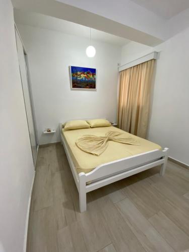 Ένα ή περισσότερα κρεβάτια σε δωμάτιο στο Hotel Andrea