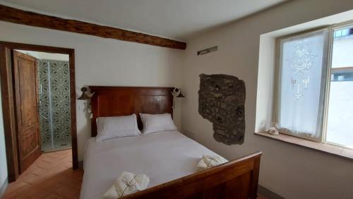 Postel nebo postele na pokoji v ubytování LA CA' DEI COMARI - Locanda da Tullio