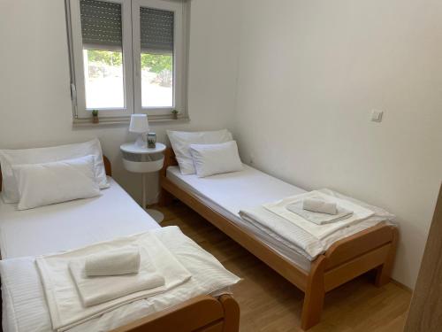 Postel nebo postele na pokoji v ubytování Villa GLAM