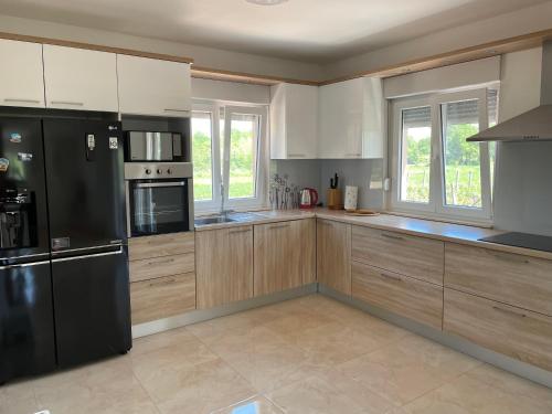 Kuchyň nebo kuchyňský kout v ubytování Villa GLAM