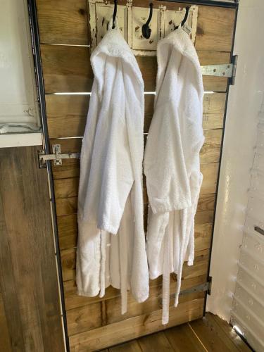 a bathroom with white towels hanging on a rack at The Yurt @ Osmore in Axminster