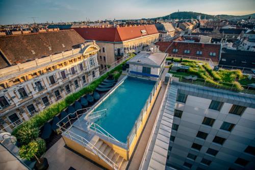 an overhead view of a building with a swimming pool on top of it at Continental Hotel Budapest in Budapest
