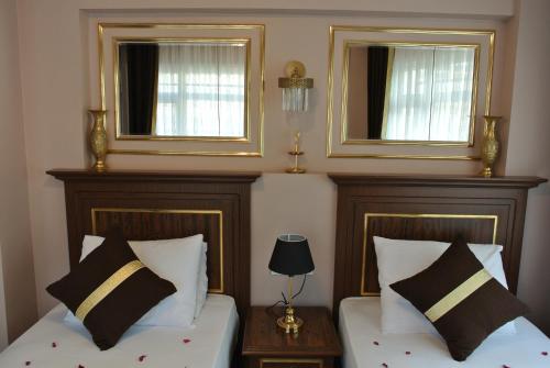 Katil atau katil-katil dalam bilik di Emirhan Guesthouse & Suites