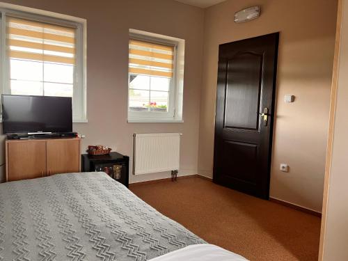 TV a/nebo společenská místnost v ubytování Hotel Marislav