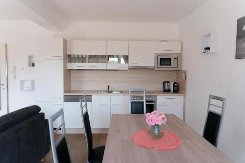 Kuchyň nebo kuchyňský kout v ubytování Apartment Falamingo Velden