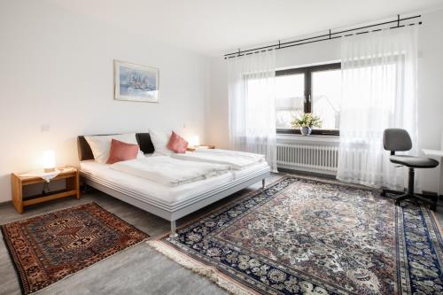 Un pat sau paturi într-o cameră la Ferienwohnung Wäller Sonnenschein