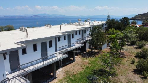 an aerial view of a building with the water in the background at MariRena Plaz in Paralion astros