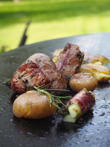 a plate of food with potatoes and meat on it at Chateau St. Havel - Wellness Hotel in Prague