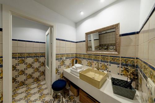 a bathroom with a sink and a mirror at La Fornal in Terrades