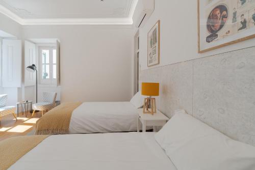 Ένα ή περισσότερα κρεβάτια σε δωμάτιο στο Almada Villa