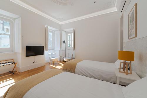 Ένα ή περισσότερα κρεβάτια σε δωμάτιο στο Almada Villa