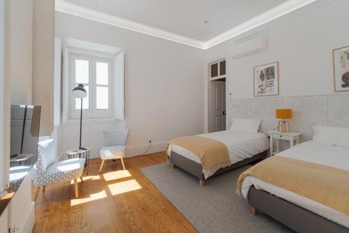 Ένα ή περισσότερα κρεβάτια σε δωμάτιο στο Almada Villa