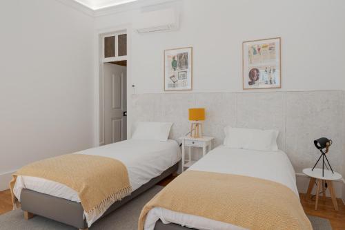 Ένα ή περισσότερα κρεβάτια σε δωμάτιο στο Almada Villa
