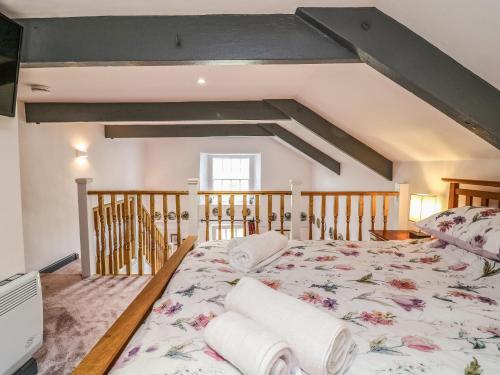 a bedroom with a large bed in a room at Wisteria Cottage in Paignton