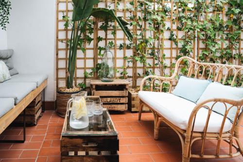 a living room with a fence with plants at HA Balmes Terrace Apartments in Barcelona