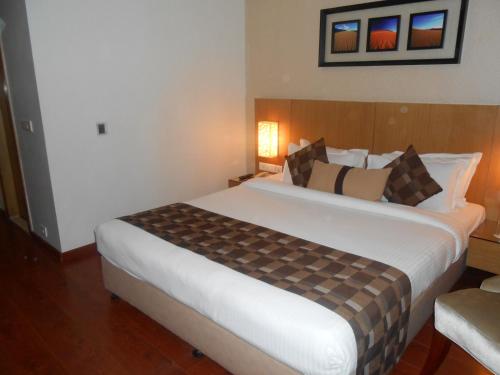 Ein Bett oder Betten in einem Zimmer der Unterkunft Siamton Inn- A Cygnett Collection