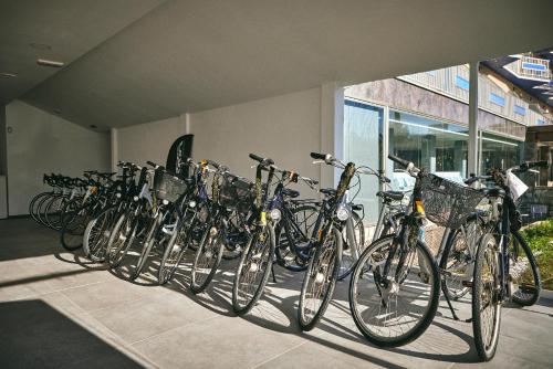 a row of bikes parked next to a building at NURA Boreal in Playa de Palma