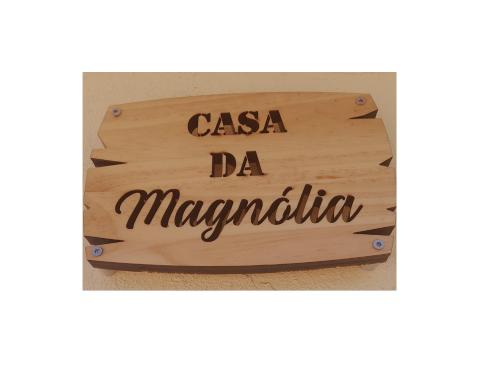 a sign that reads casa da margarita on a wooden board at Casa da Magnólia in Raposeira