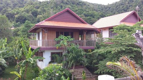a house in the middle of a forest at TARA LODGE Haven of peace in Kep