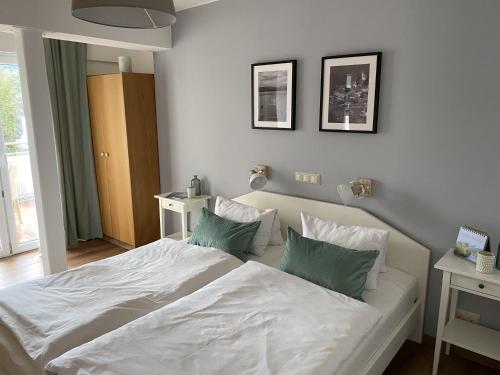 Posteľ alebo postele v izbe v ubytovaní Carlotta Apartment