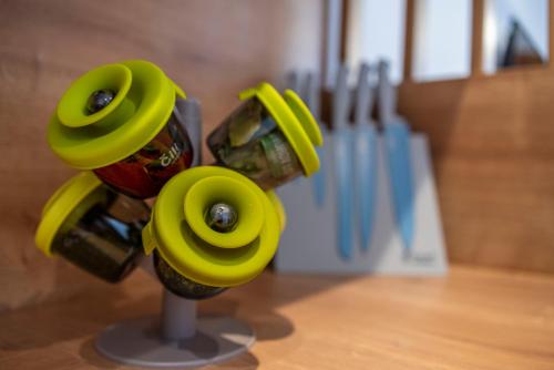 a bottle opener with yellow flowers on a table at PINNA RESIDENCE - VANGA in Pula