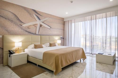 Ένα ή περισσότερα κρεβάτια σε δωμάτιο στο Lagos Atlantic Hotel
