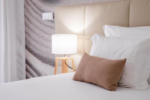 Ένα ή περισσότερα κρεβάτια σε δωμάτιο στο Lagos Atlantic Hotel